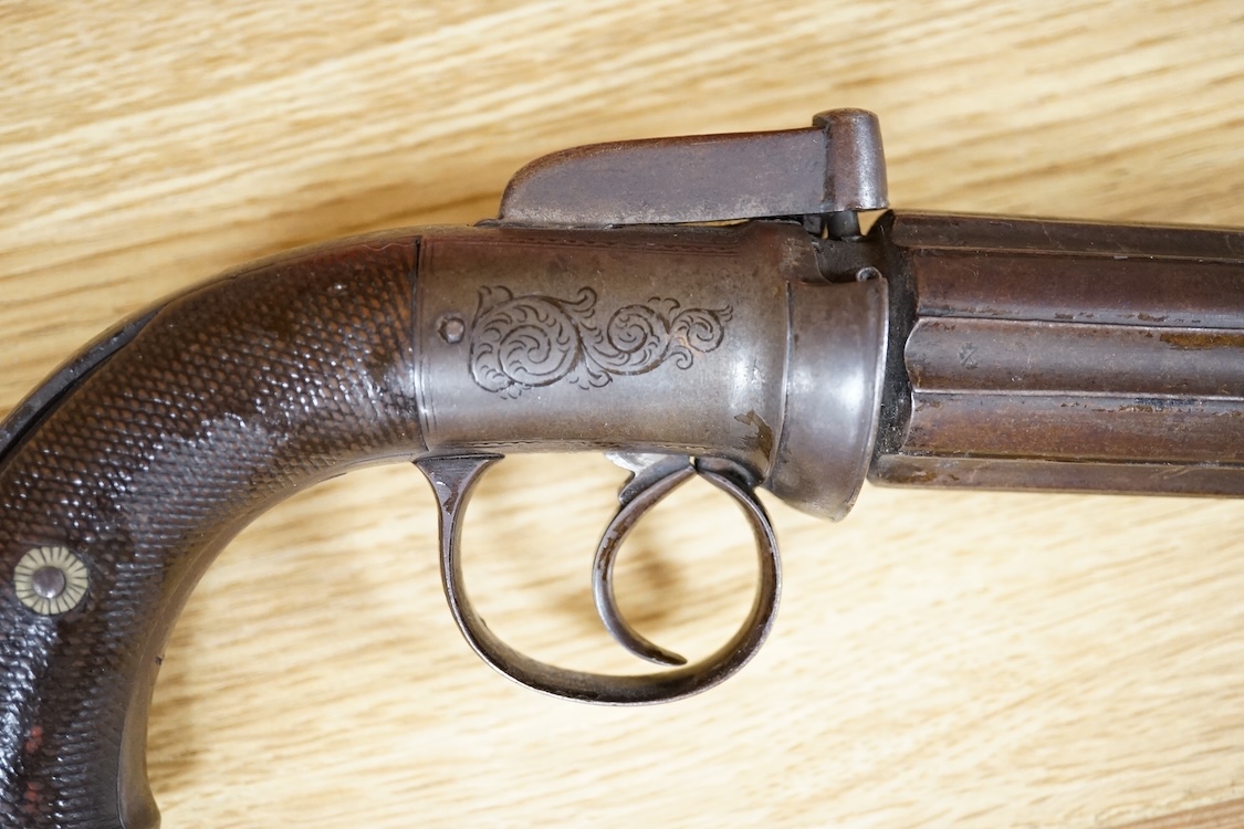 A six shot 120 bore self-cocking percussion pepperbox revolver with fluted barrels, Birmingham proof, rounded foliate engraved frame, and two-piece chequered walnut grips
